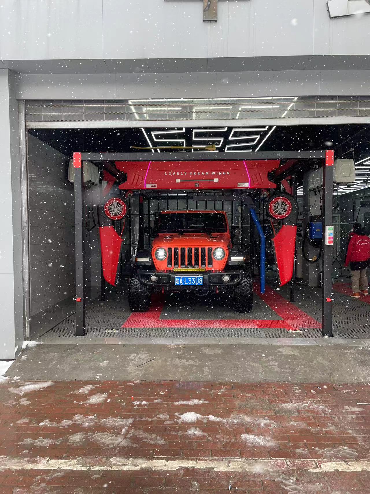 Red Power in the Snow: Stunning Car Wash Scene